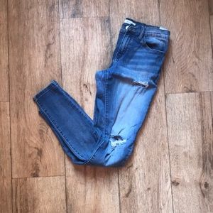 Medium dark wash distressed skinny jeans